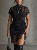 Black chiffon mini dress with pleated waist and lace trim - Plus size model